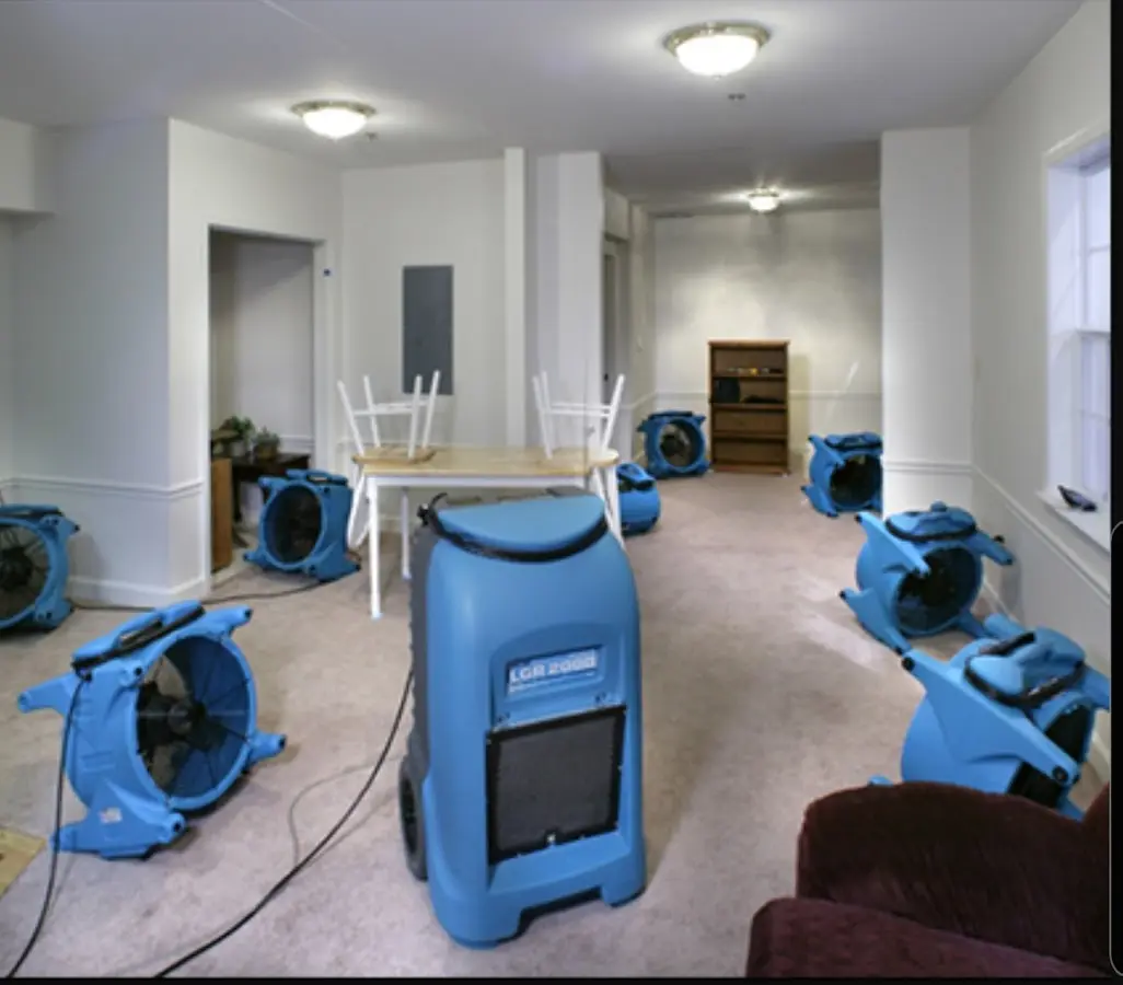 Air movers and dehumidifier setup for Water Damage Restoration in New Richmond