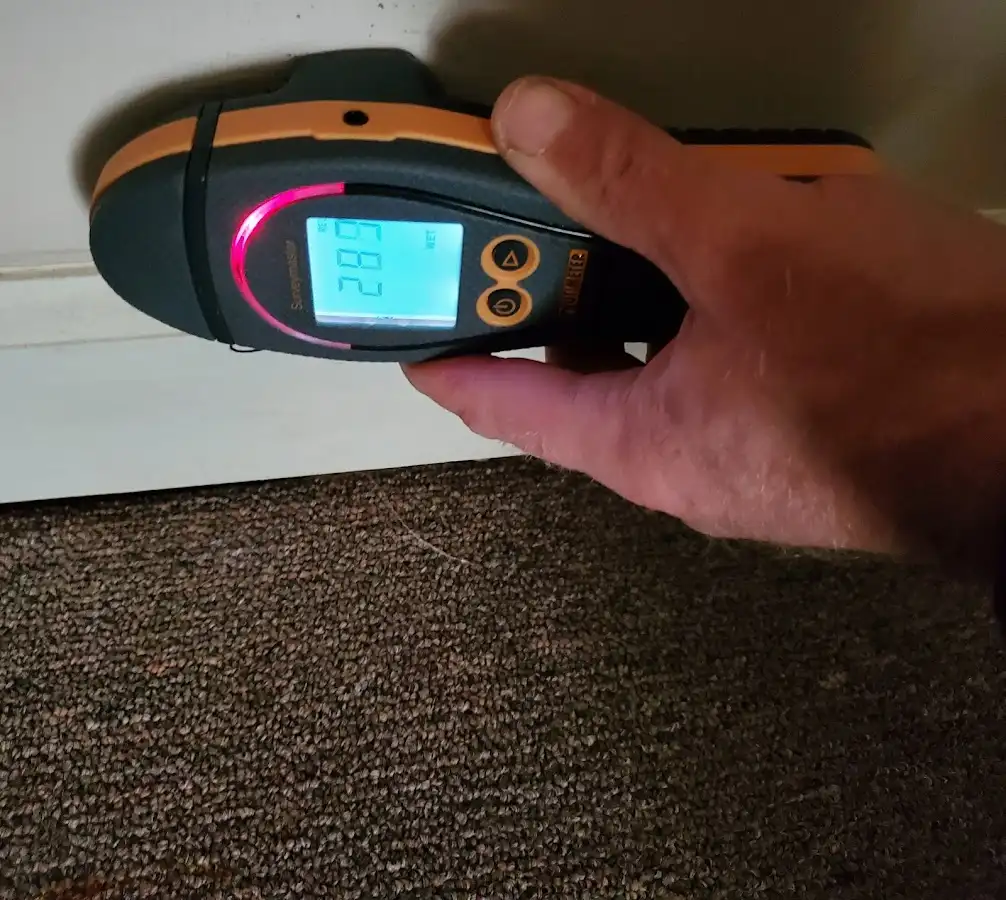 Moisture detection at baseboard during Burst Pipe Cleanup in New Richmond